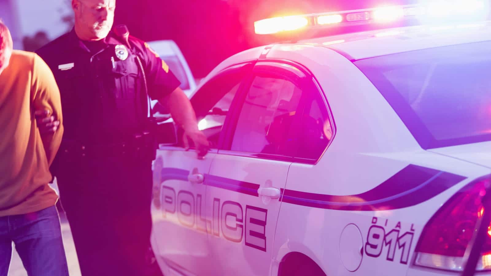 Police Officer Making An Arrest Stock Photo