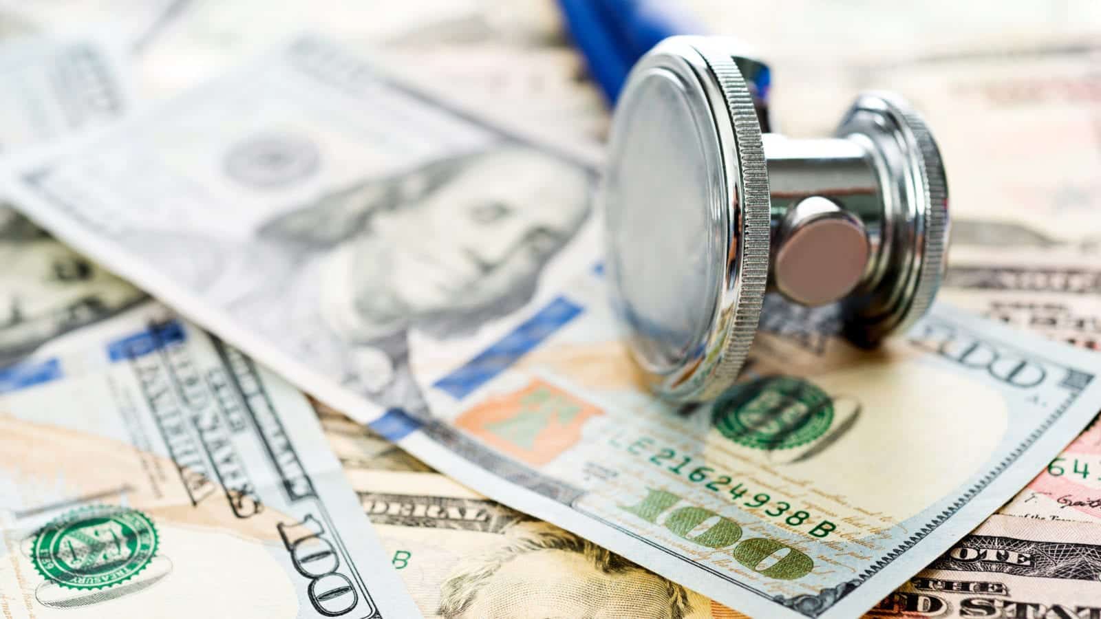 Stethoscope and Dollar Bills Stock Photo