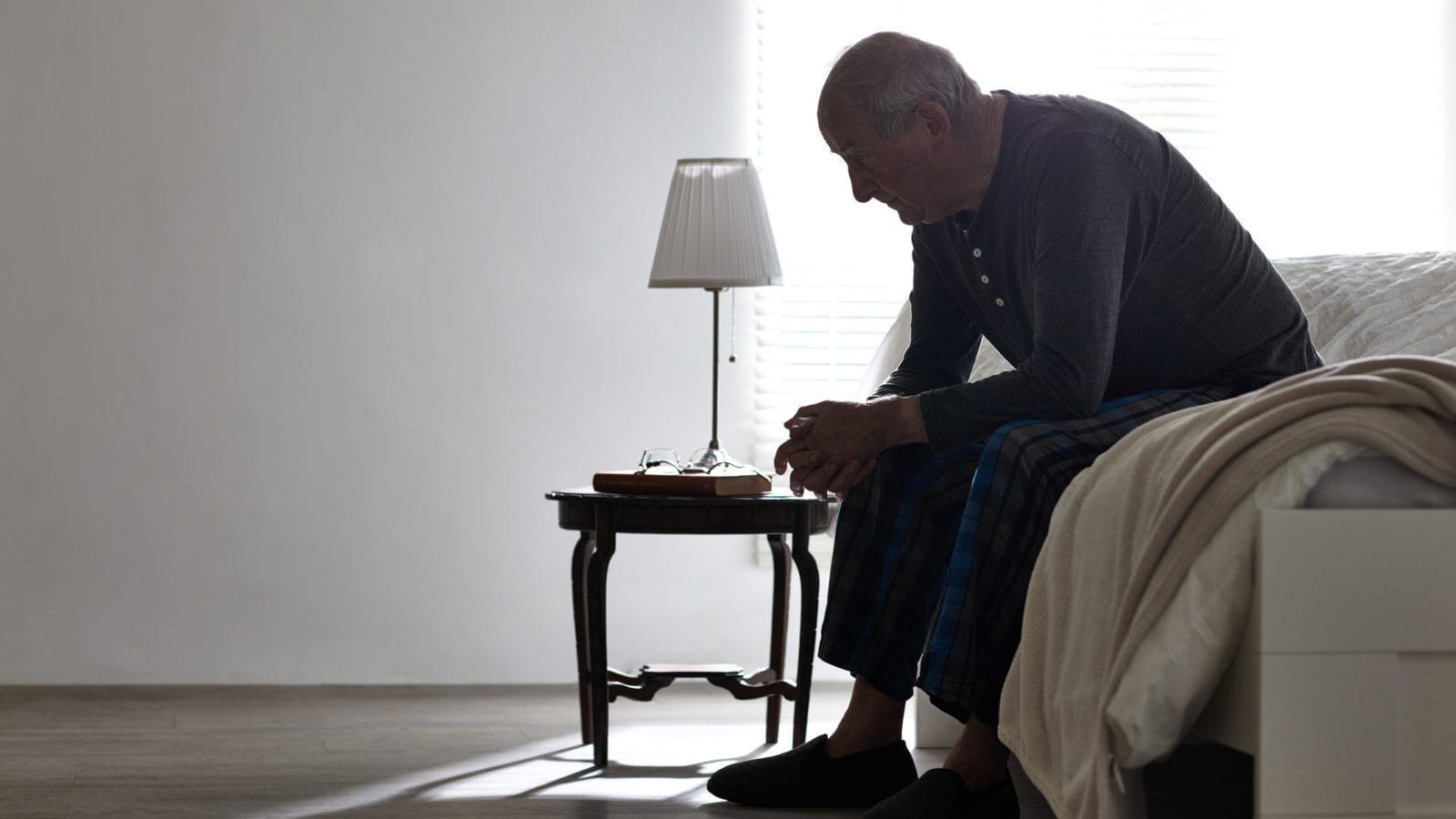 Elderly Man Bedroom Stock Photo