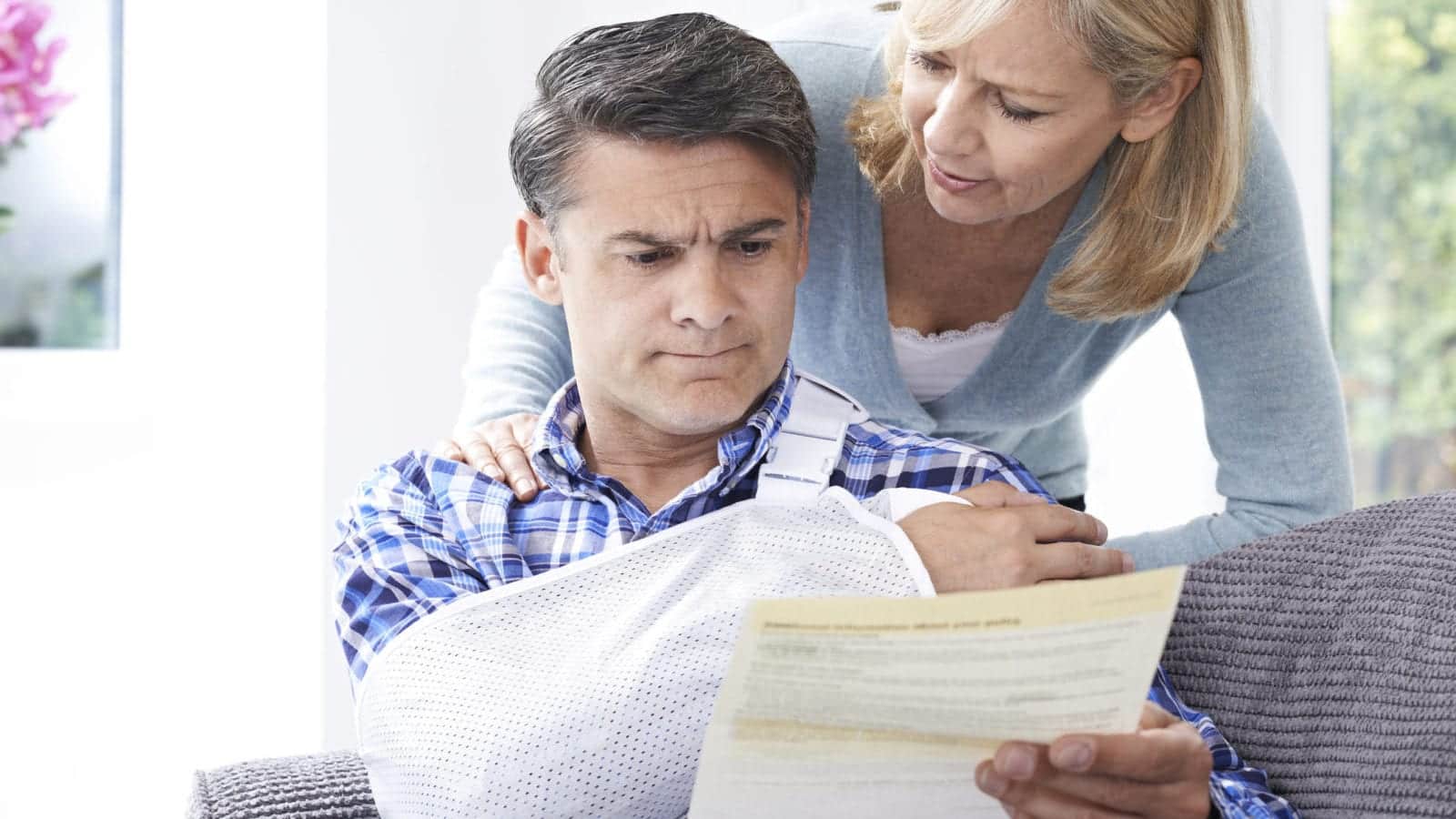 Couple Reading Letter About Husband's Injury