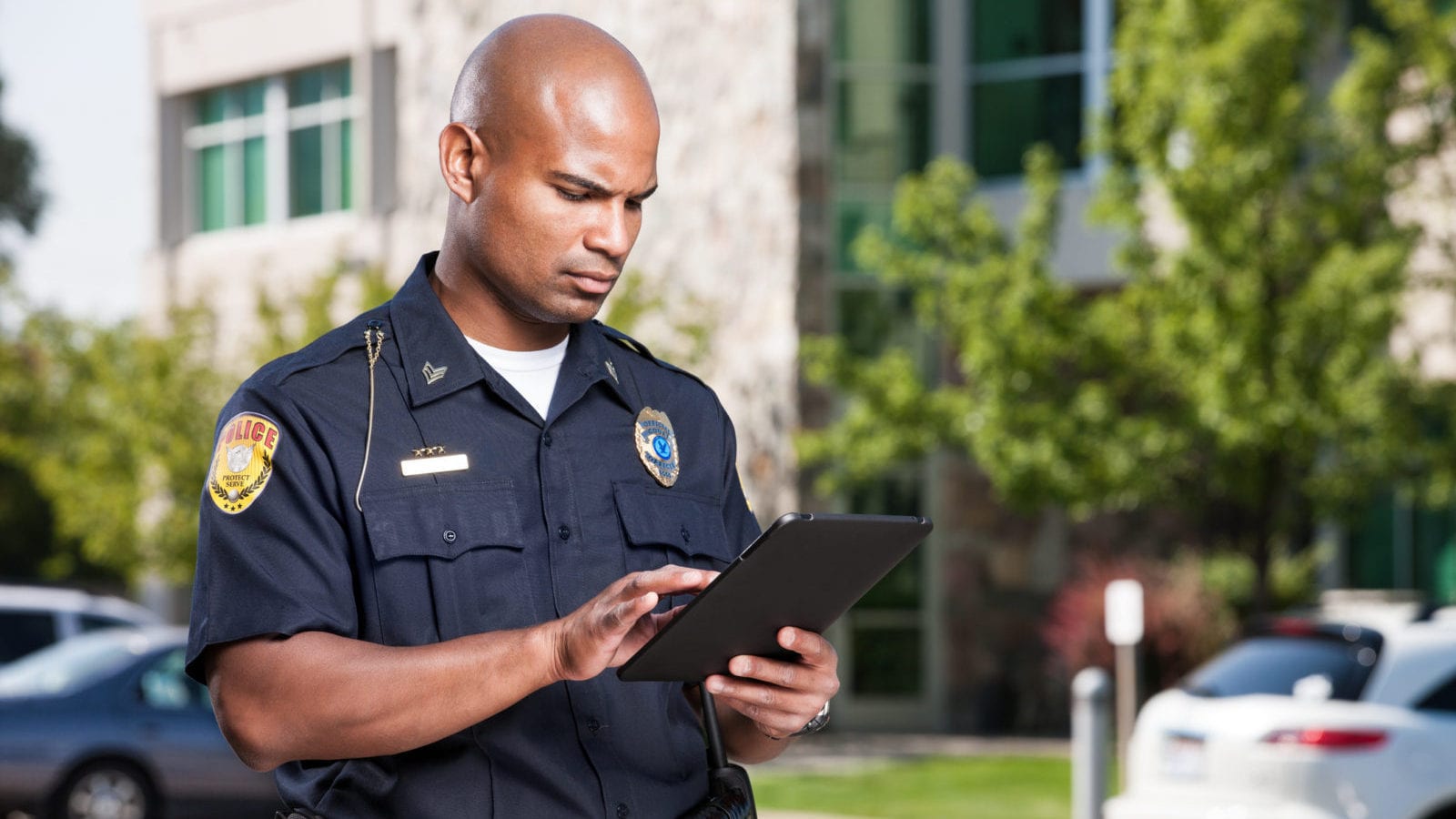 Police Officer Using Computer Tablet