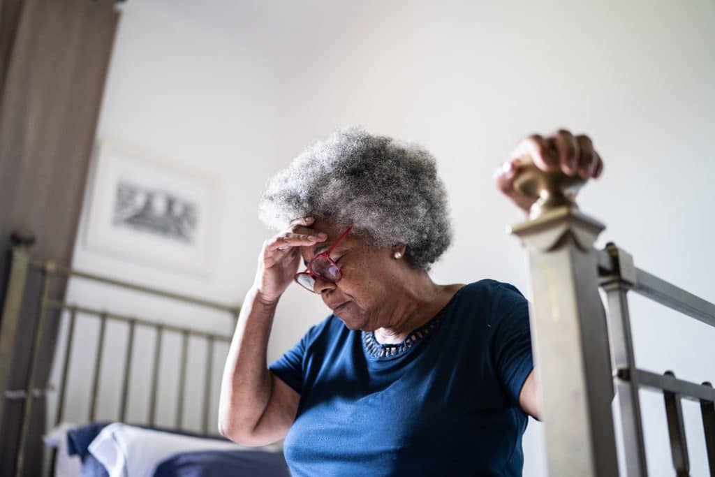An elderly lady dealing with the stress of being financially abused.