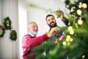 father-and-son-decorating-christmas-tree