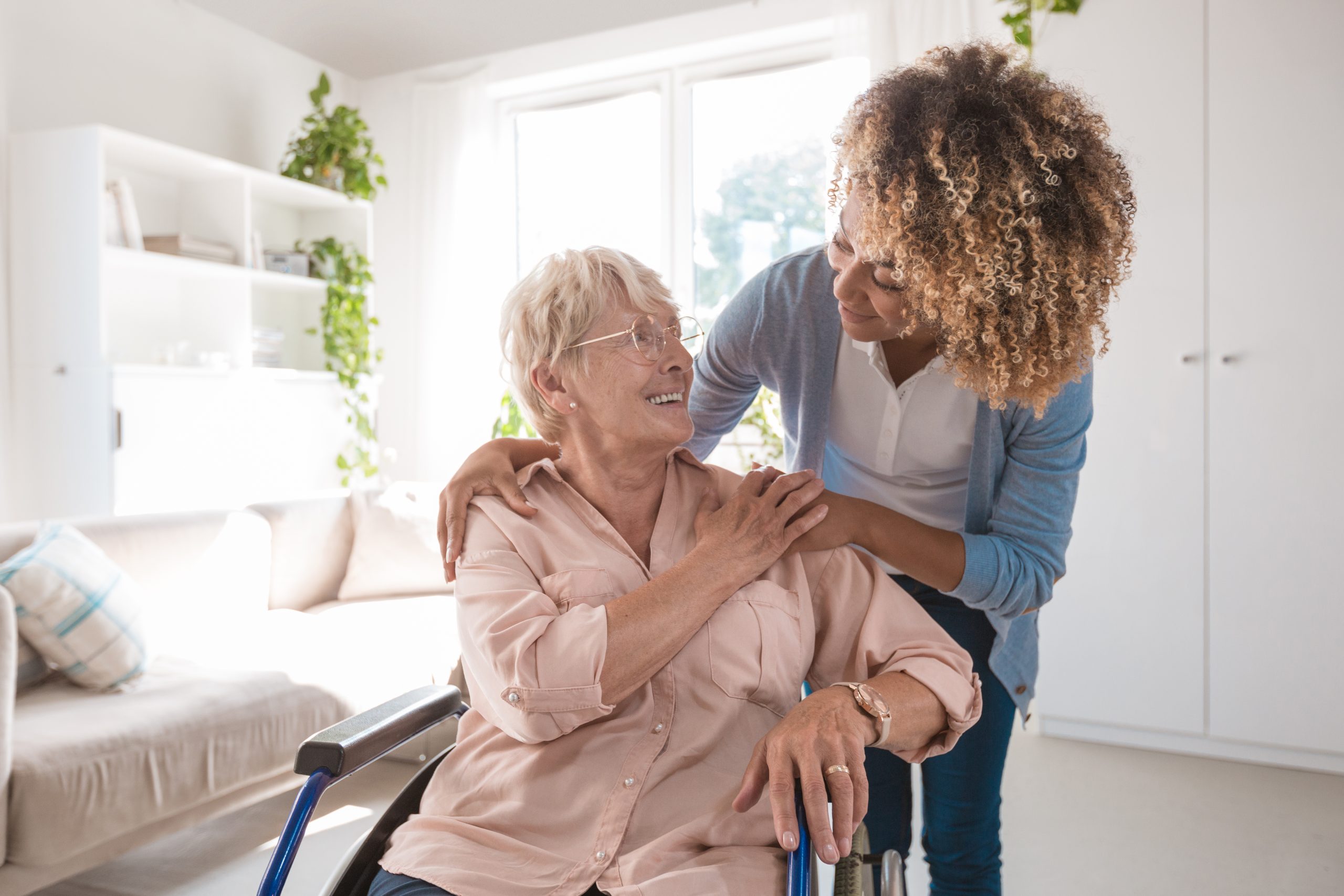 Happy Nursing Home Resident With Her Caregiver