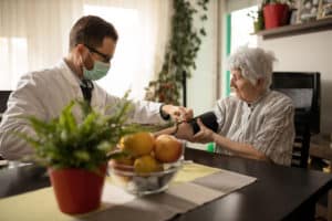 doctor providing care to a nursing home resident