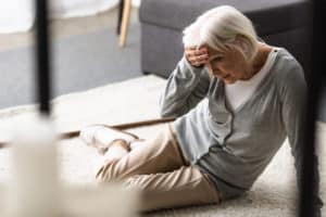 a senior woman after experiencing a fall due to neglect