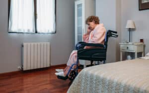 a senior woman experiencing isolation in her Charleston, WV, nursing home facility