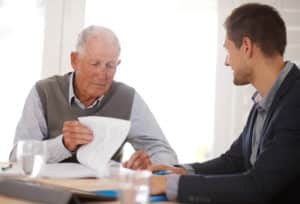 a man reviewing his nursing home agreement paperwork in Charleston, WV