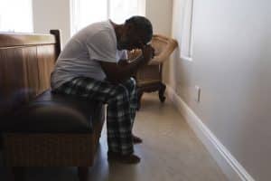 An elderly man in Charleston, WV, looking distraught after suffering elder abuse.